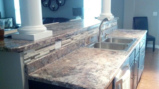 New kitchen counter island with cabinets and sink