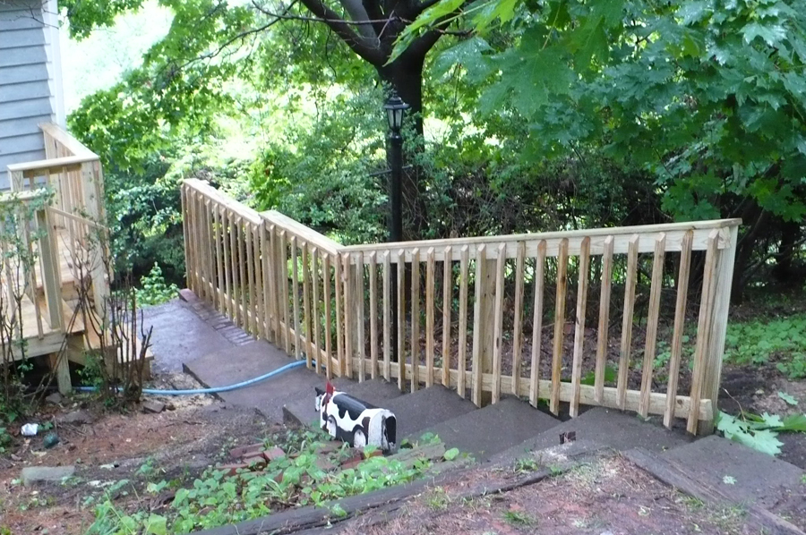 new fence railing beside stairs